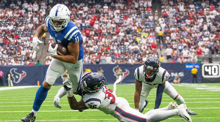 Sep 11, 2022; Houston, Texas, USA; Indianapolis Colts wide receiver Michael Pittman Jr. (11) scores a touchdown against Houston Texans Houston Texans safety Jonathan Owens (36) in the fourth quarter at NRG Stadium.